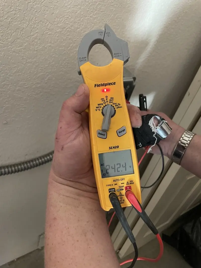 Voltage testing with clamp meter during Electrical Installation Services in Mead